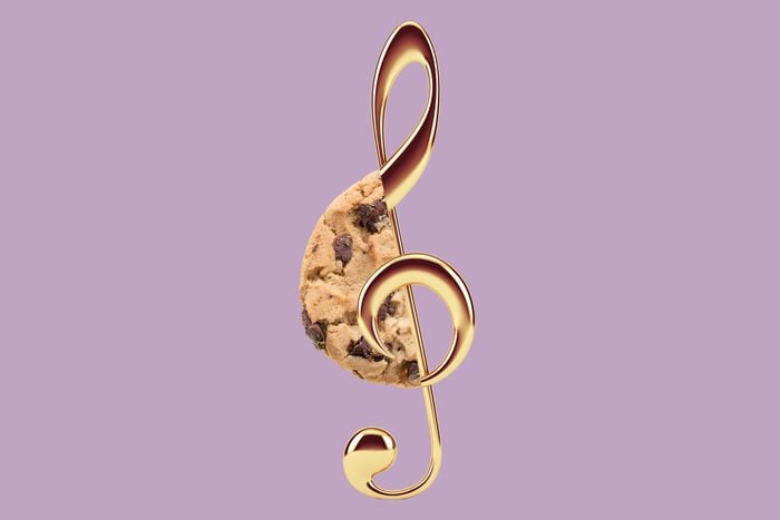 famous amos chocolate chip cookie collaged with a gold treble clef