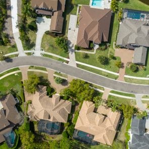 Suburban homes pictured by an overhead drone in an unknown city or suburban neighborhood
