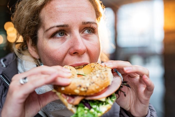 Close-up of woman eating sandwich