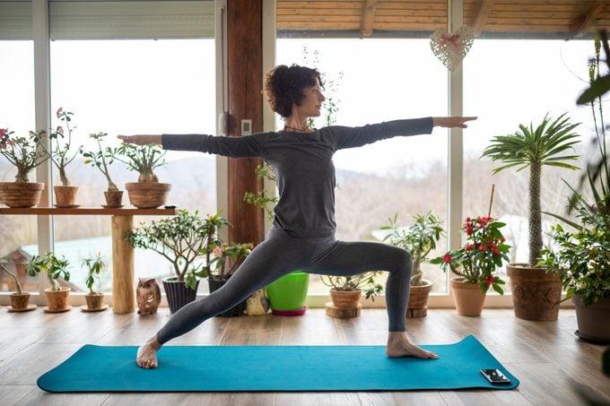 Woman doing yoga exercise at home