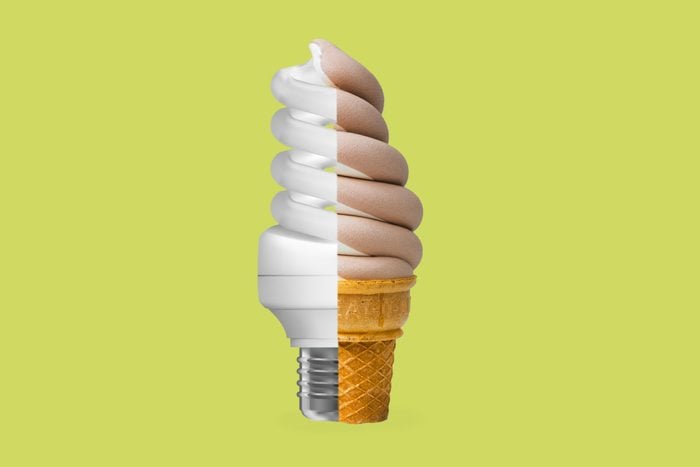 light bulb and ice cream cone fused together on green